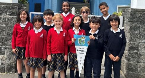 Students holding an Earth Rangers Class banner